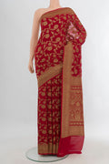 Deep Red Banarasi Georgette Saree with Zari Brocade on the body and Zari Border.  displayed on a mannequin