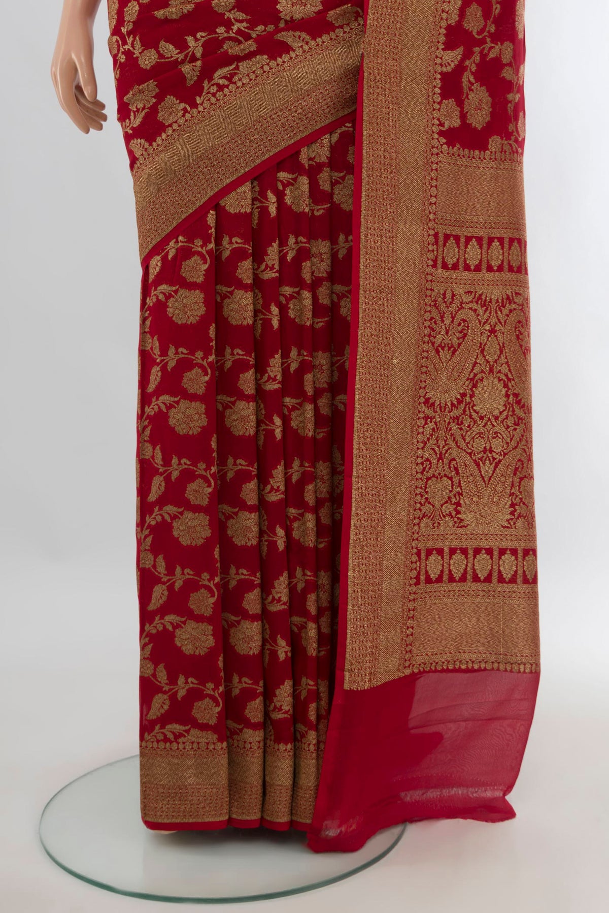 Pleats and pallu of Deep Red Banarasi Georgette Saree with Zari Brocade on the body and Zari Border. 