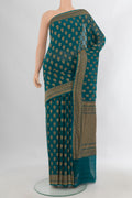 Teal Banarasi Georgette Saree with Zari Butta on the body and Zari Border.  displayed on a mannequin