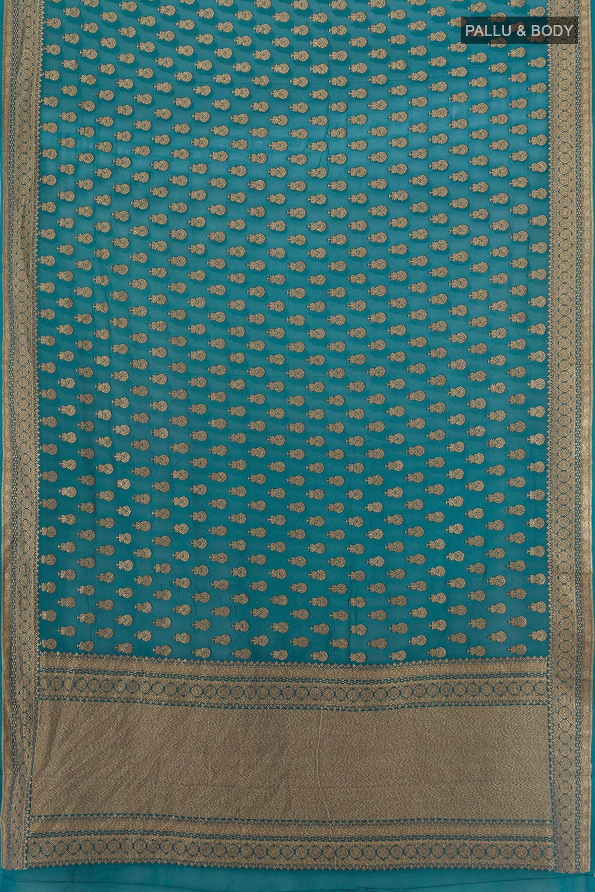 Flat view of Teal Banarasi Georgette Saree with Zari Butta on the body and Zari Border. 