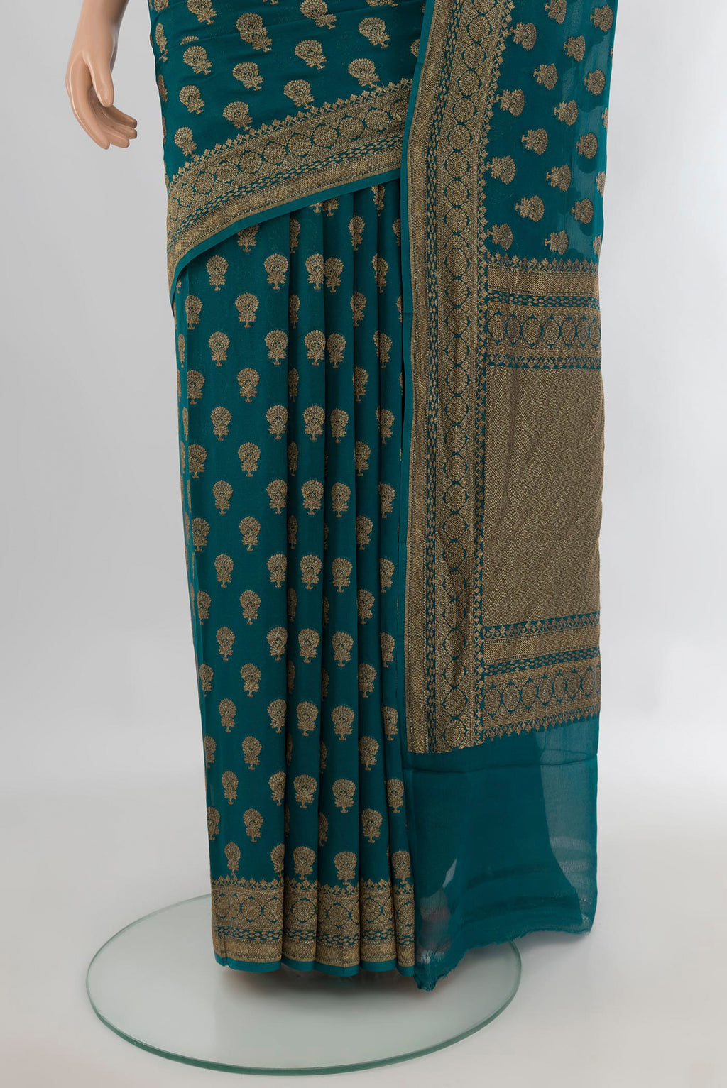 Pleats and pallu of Teal Banarasi Georgette Saree with Zari Butta on the body and Zari Border. 