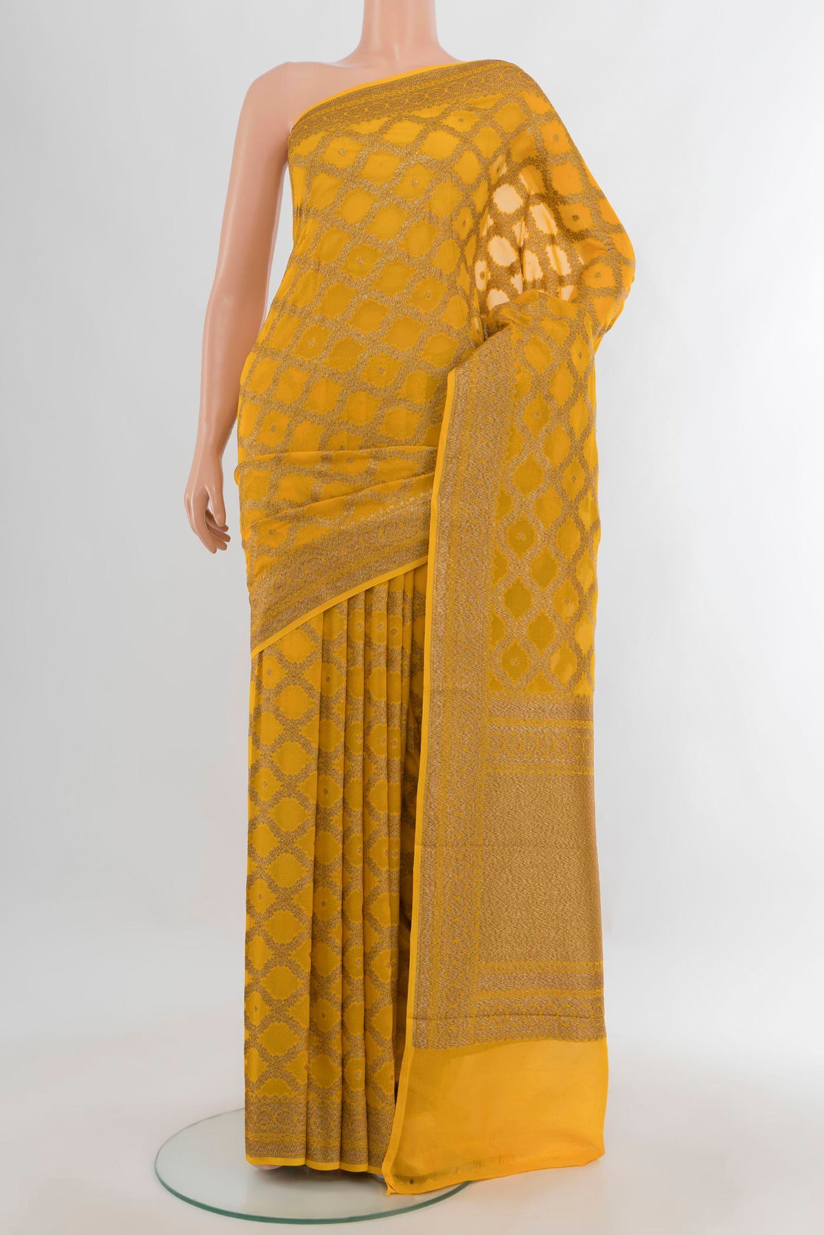 Yellow Banarasi Georgette Saree with Checked design on the body and Zari Border.  displayed on a mannequin