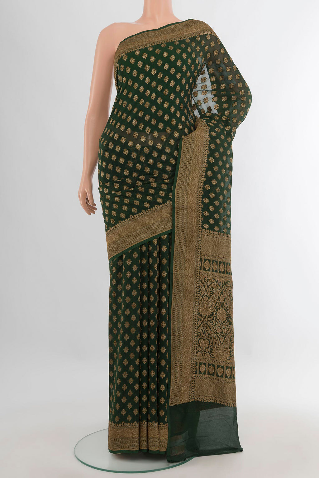 Bottle Green Banarasi Georgette Saree with Zari Butta on the body and Zari Border.  displayed on a mannequin