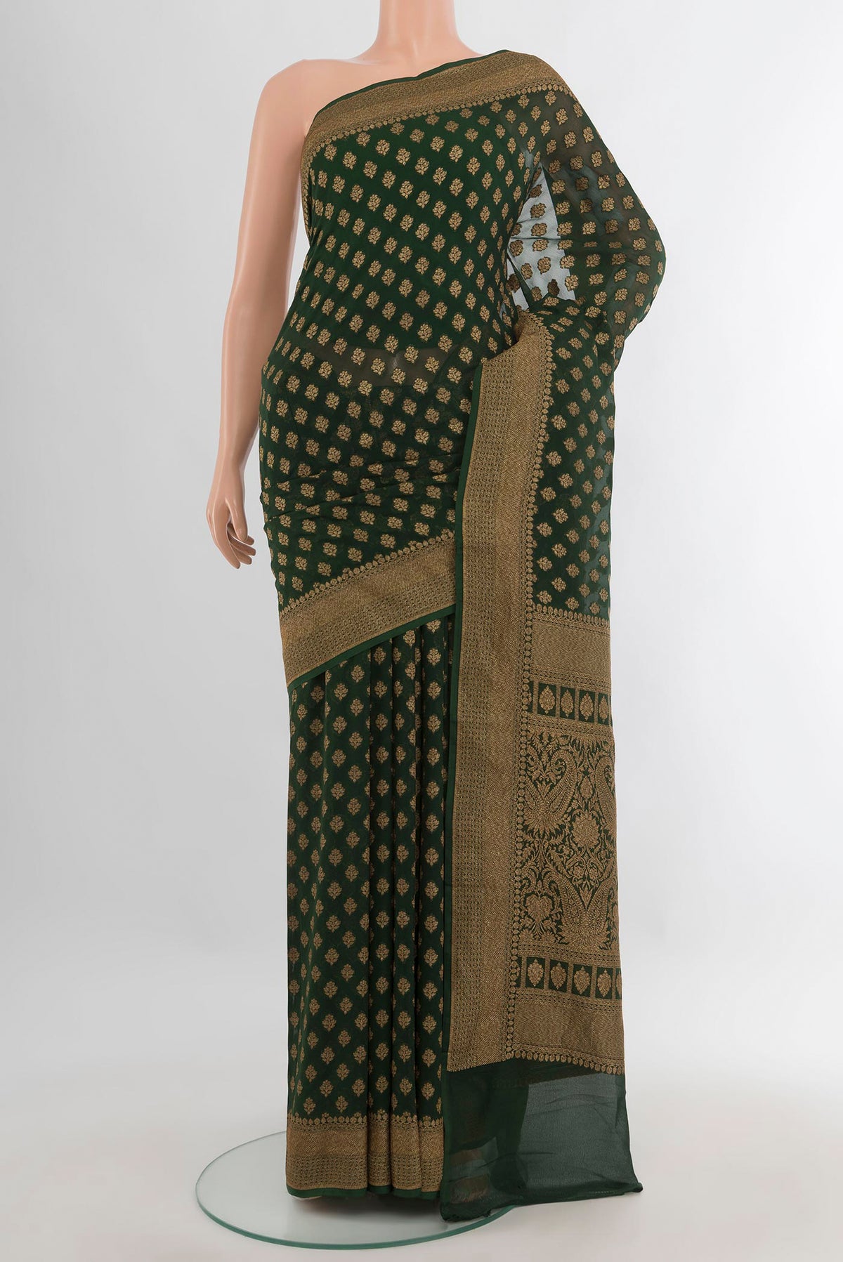 Bottle Green Banarasi Georgette Saree with Zari Butta on the body and Zari Border.  displayed on a mannequin