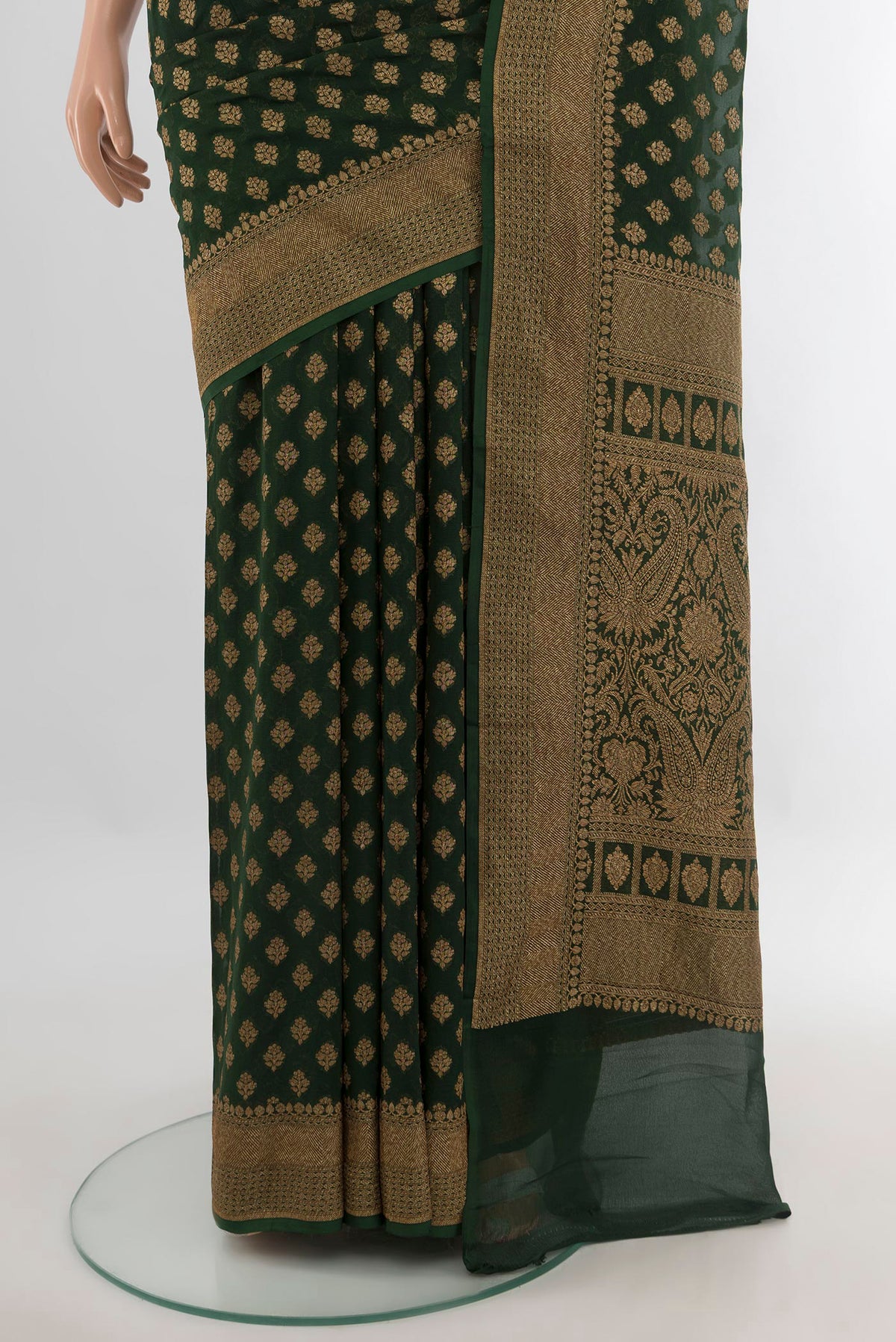 Pleats and pallu of Bottle Green Banarasi Georgette Saree with Zari Butta on the body and Zari Border. 