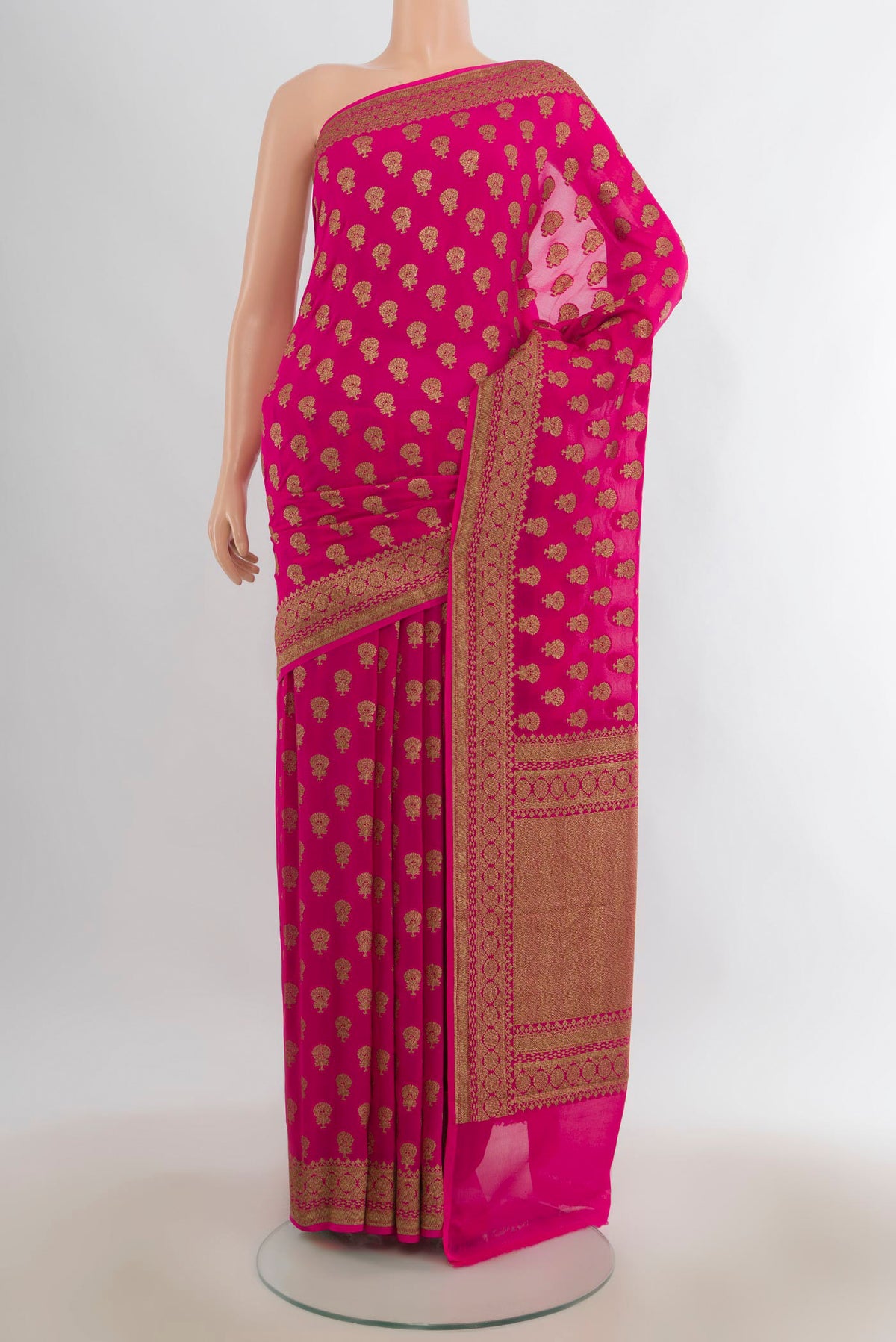 Rani Pink Banarasi Georgette Saree with Zari Butta on the body and Zari Border.  displayed on a mannequin