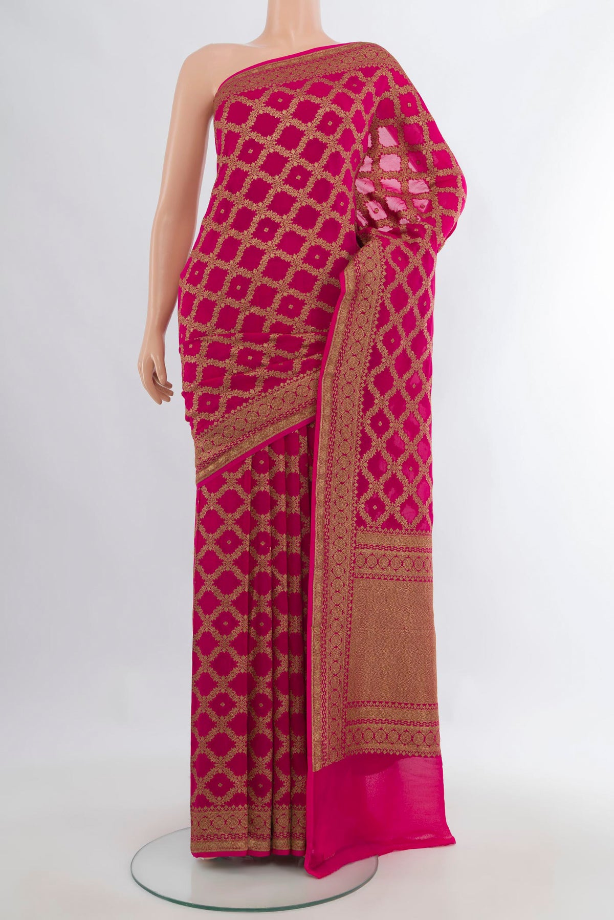 Rani Pink Banarasi Georgette Saree with Zari Brocade on the body and Zari Border.  displayed on a mannequin