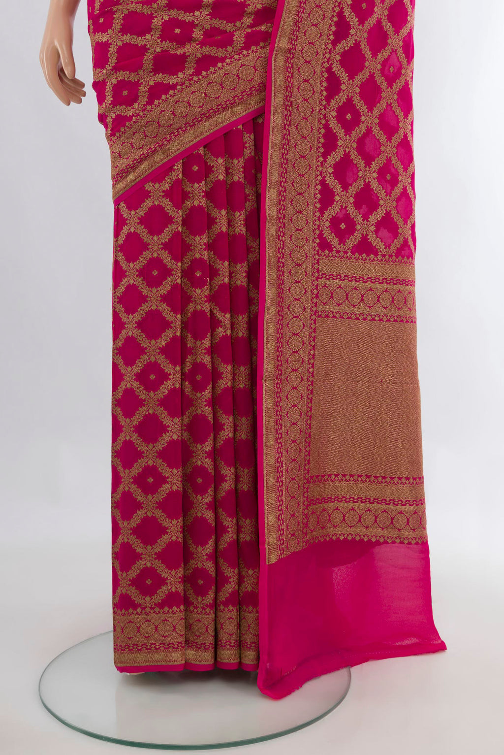 Pleats and pallu of Rani Pink Banarasi Georgette Saree with Zari Brocade on the body and Zari Border. 