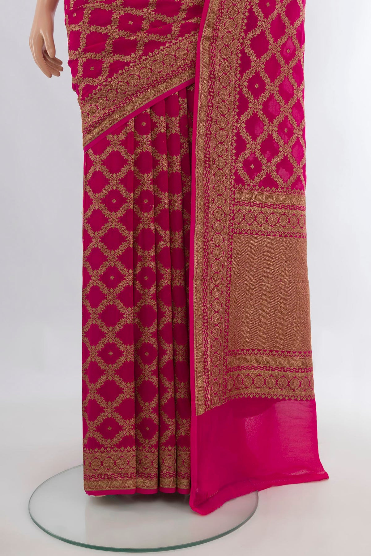 Pleats and pallu of Rani Pink Banarasi Georgette Saree with Zari Brocade on the body and Zari Border. 