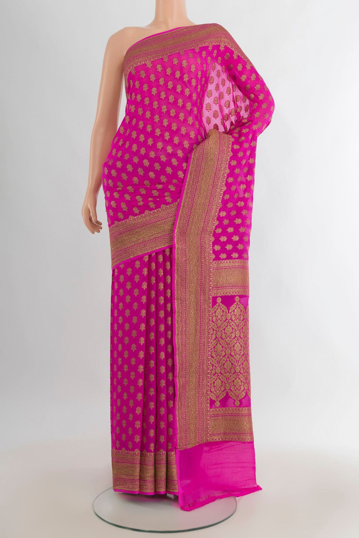 Rani Pink Banarasi Georgette Saree with Zari Butta on the body and Zari Border.  displayed on a mannequin