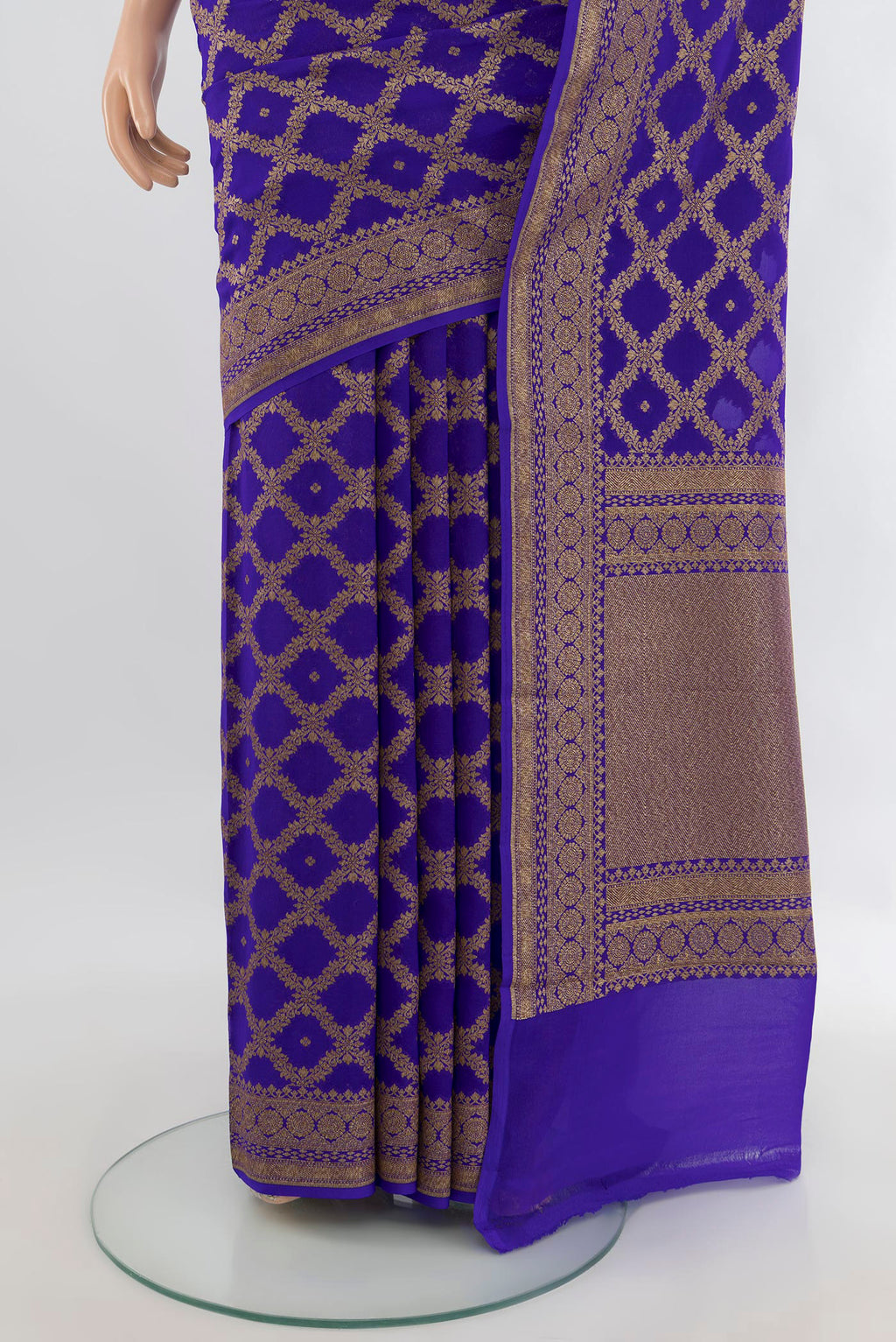 Pleats and pallu of Royal Blue Banarasi Georgette Saree with Zari Butta on the body and Zari Border. 