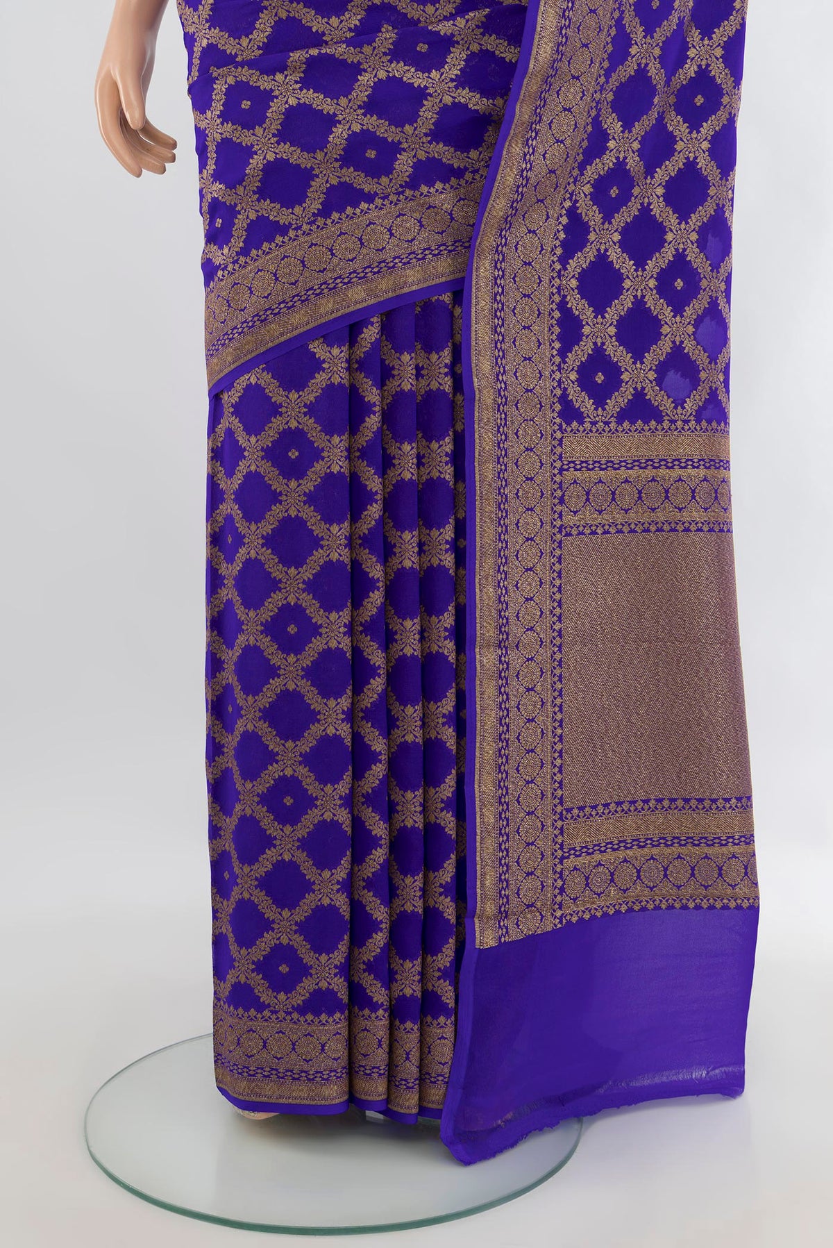 Pleats and pallu of Royal Blue Banarasi Georgette Saree with Zari Butta on the body and Zari Border. 