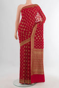 Red Banarasi Georgette Saree with Zari Butta on the body and Zari Border.  displayed on a mannequin
