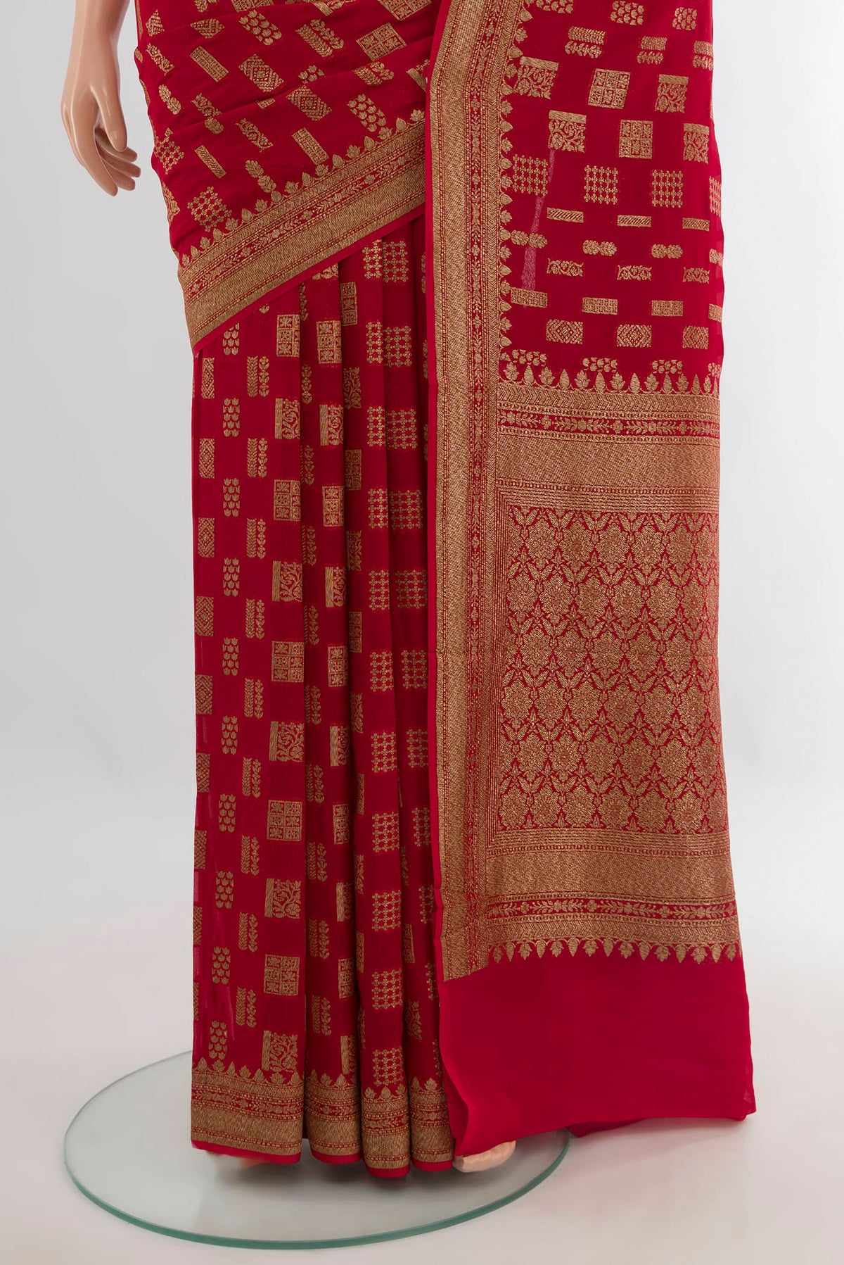 Pleats and pallu of Red Banarasi Georgette Saree with Zari Butta on the body and Zari Border. 