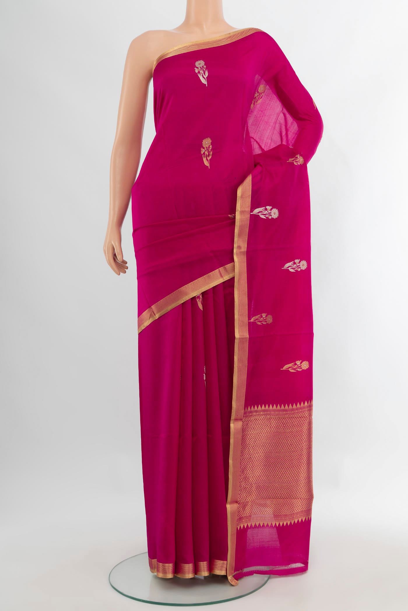 Rani Pink Banarasi Katan Silk Saree with Zari Butta on the body and Zari Border.  displayed on a mannequin