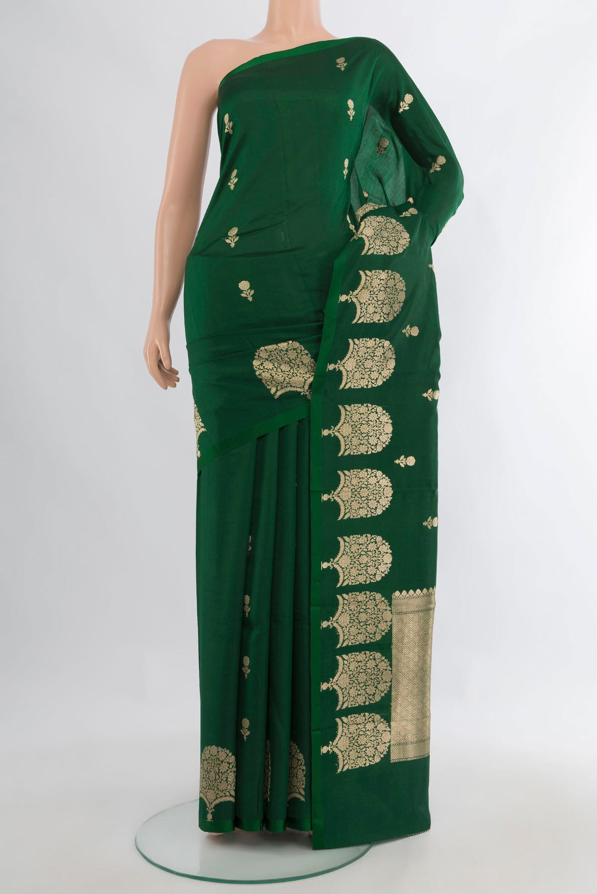 Pure Silk Green Banarasi Katan Saree with Zari Butta on the body and Plain Border.  displayed on a mannequin
