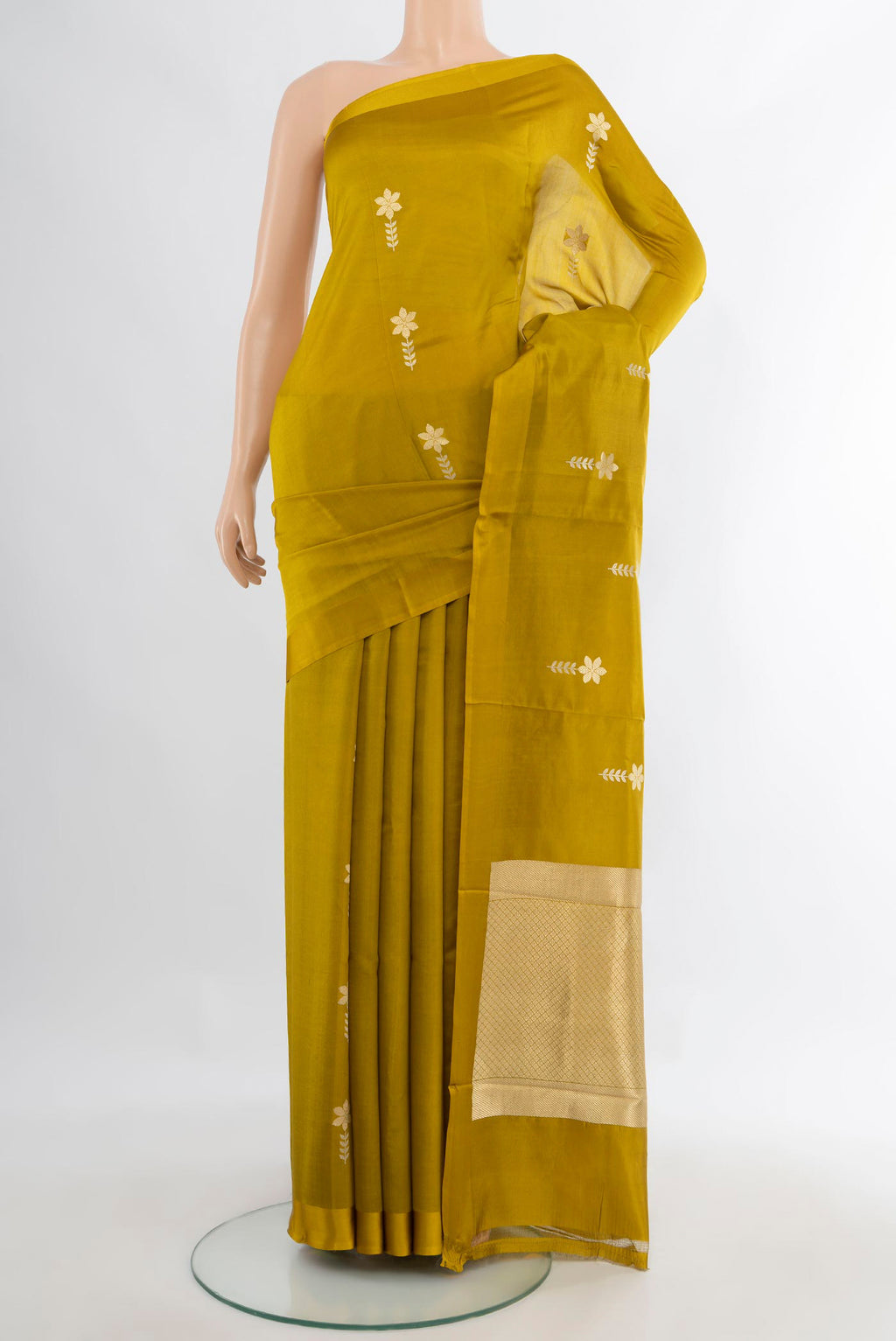Pure Silk Mehandi Green Banarasi Katan Saree with Zari Butta on the body and Plain Border.  displayed on a mannequin