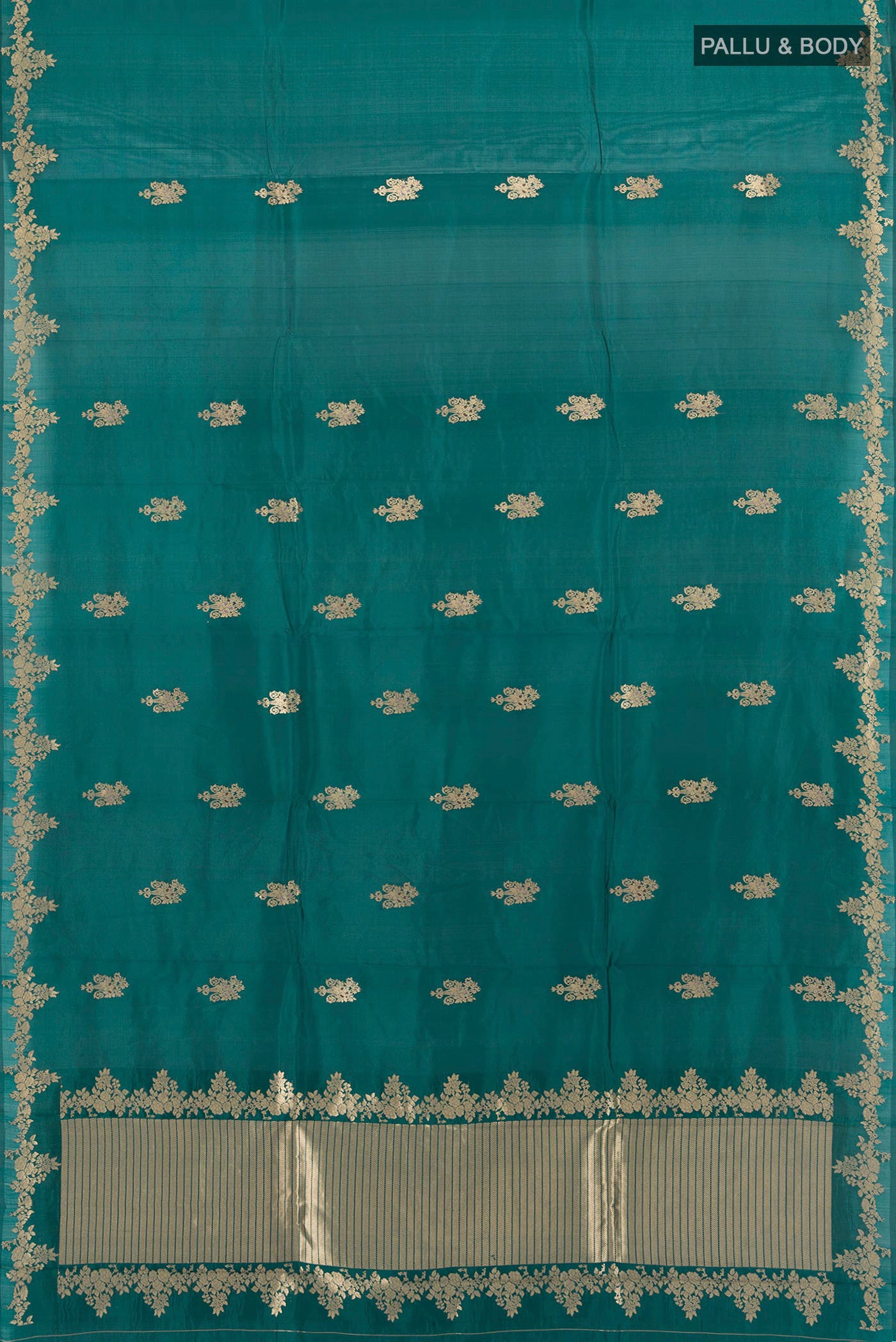 Flat view of Pure Silk Teal Banarasi Katan Saree with Zari Butta on the body and Zari Border. 