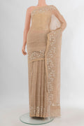 Beige Linen Saree with Plain Body and Embroidery Border.  displayed on a mannequin