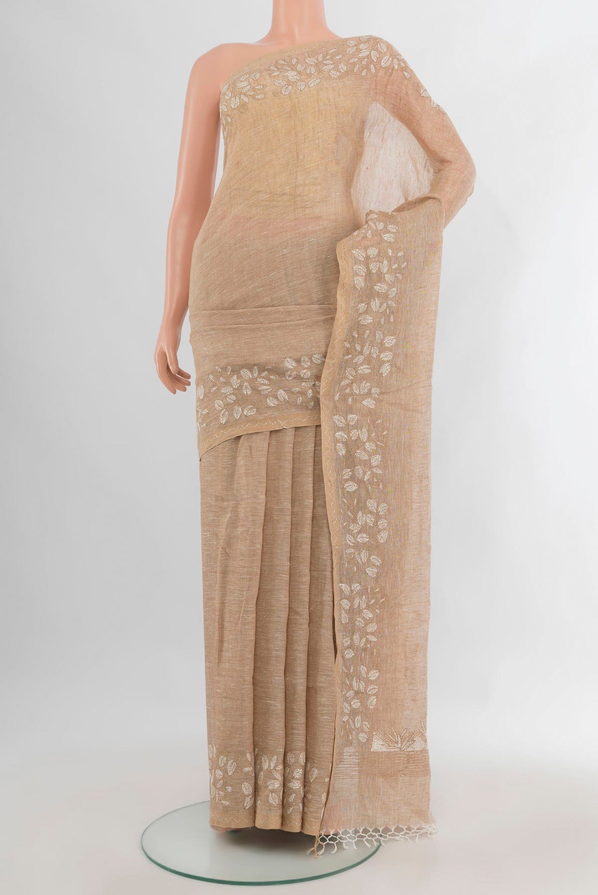 Beige Linen Saree with Plain Body and Embroidery Border.  displayed on a mannequin