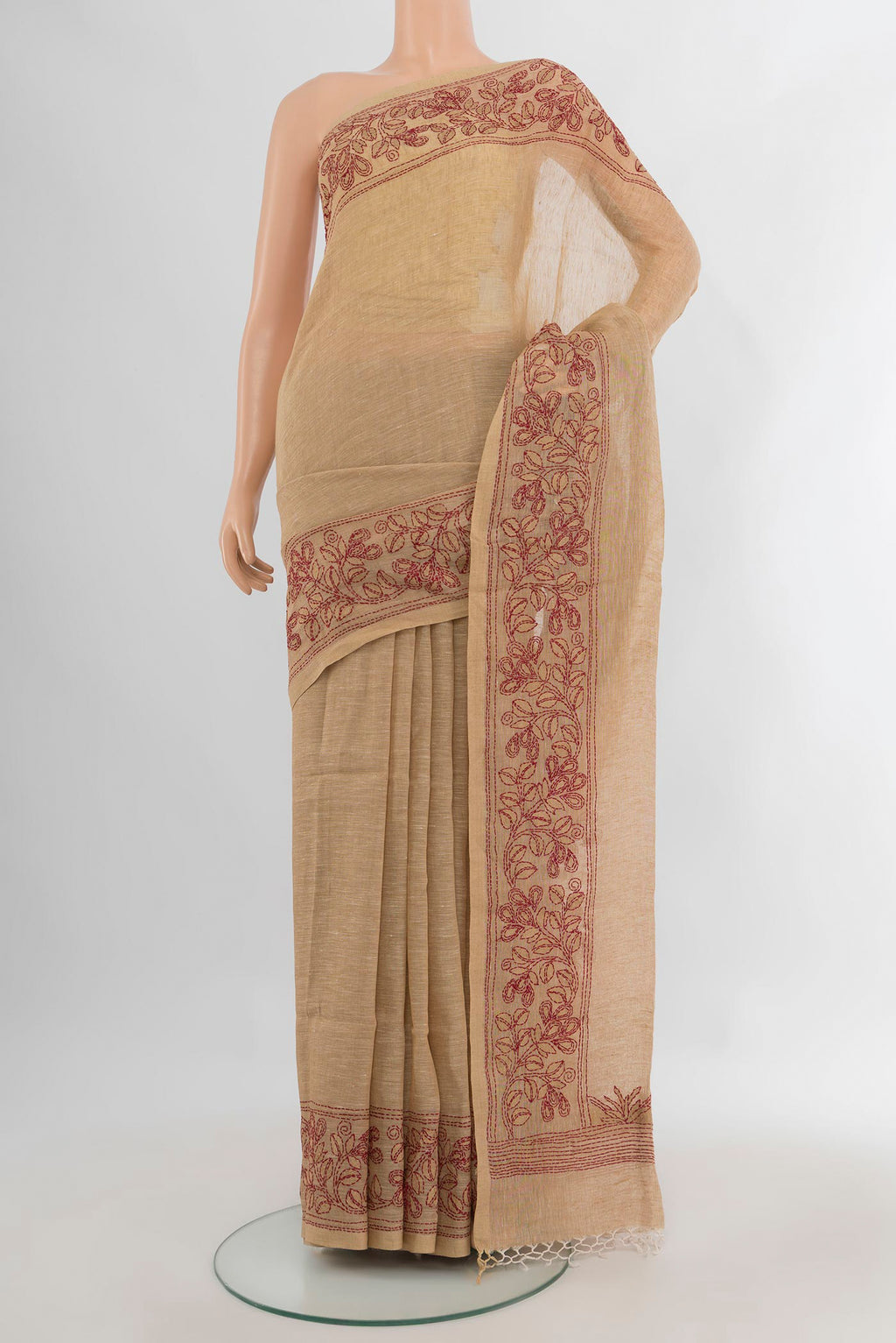 Beige Linen Saree with Plain Body and Embroidery Border.  displayed on a mannequin
