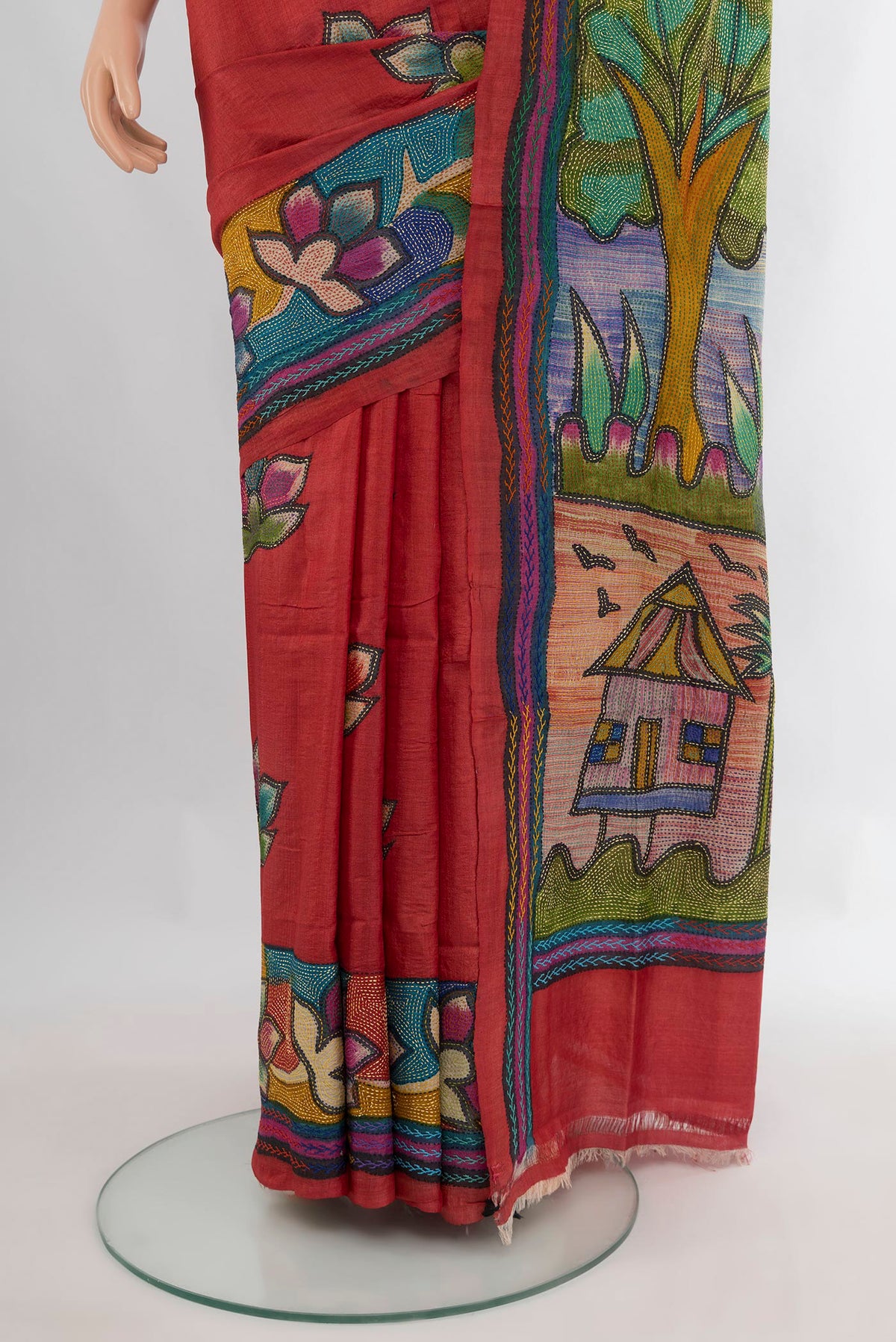 Pleats and pallu of Red Tussar Saree with Embroidery on the body and Embroidery Border. 