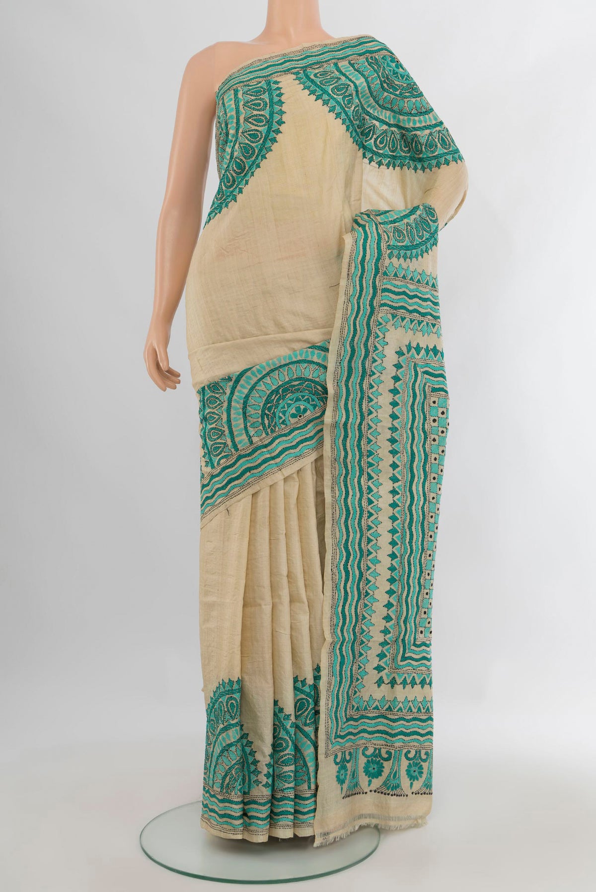 Beige Tussar Saree with Plain Body and Embroidery Border.  displayed on a mannequin
