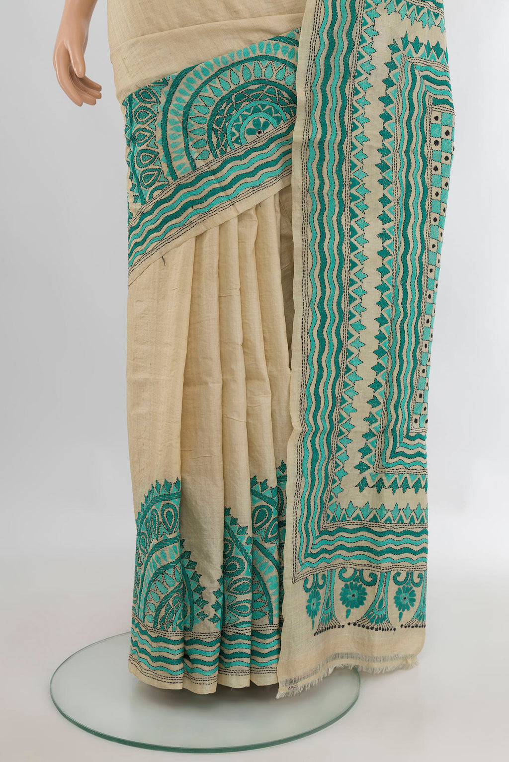 Pleats and pallu of Beige Tussar Saree with Plain Body and Embroidery Border. 