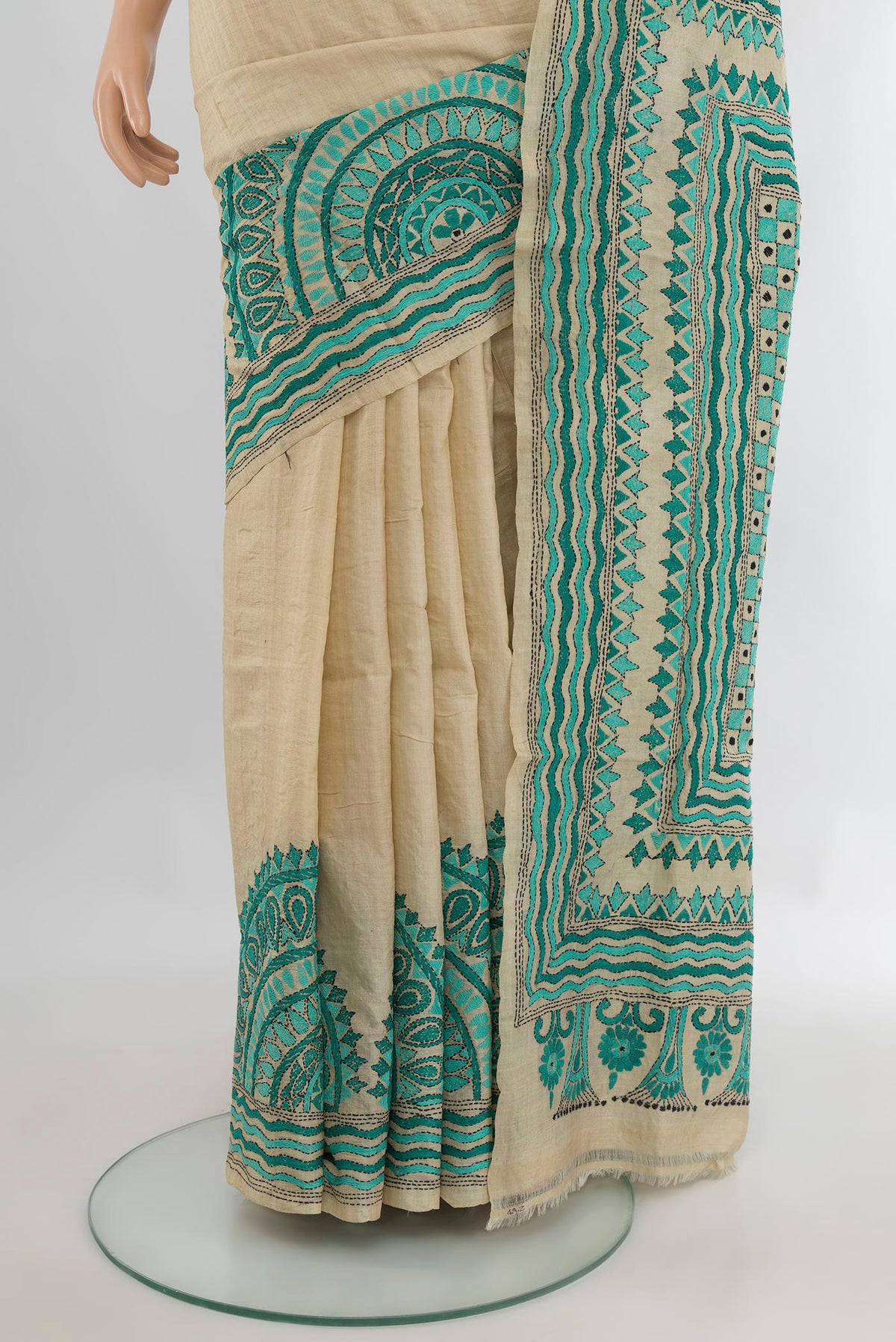 Pleats and pallu of Beige Tussar Saree with Plain Body and Embroidery Border. 