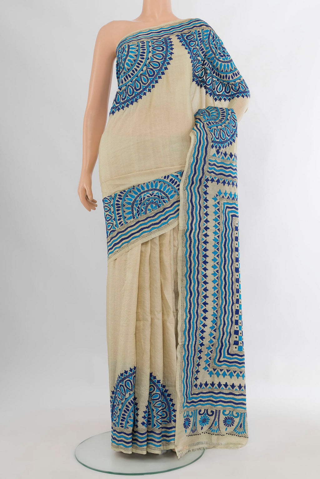 Cream Tussar Saree with Plain Body and Embroidery Border.  displayed on a mannequin