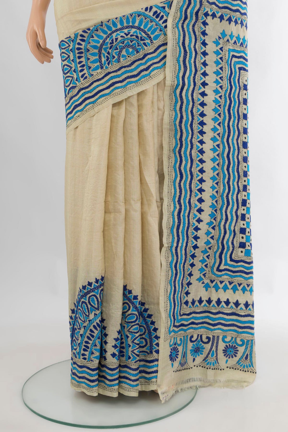 Pleats and pallu of Cream Tussar Saree with Plain Body and Embroidery Border. 