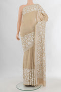 Beige Tussar Saree with Kantha Work on the body and Embroidery Border.  displayed on a mannequin