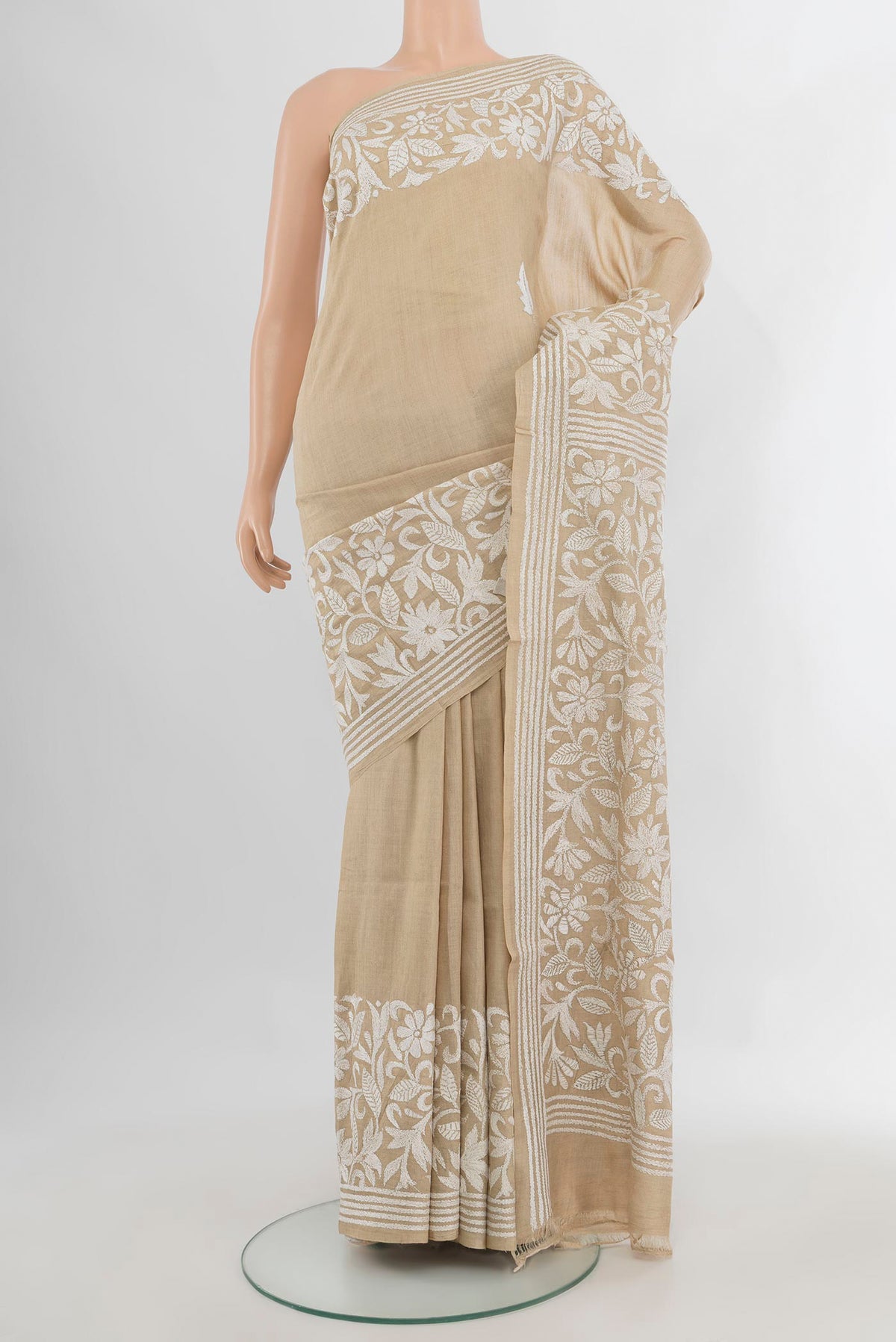 Beige Tussar Saree with Kantha Work on the body and Embroidery Border.  displayed on a mannequin