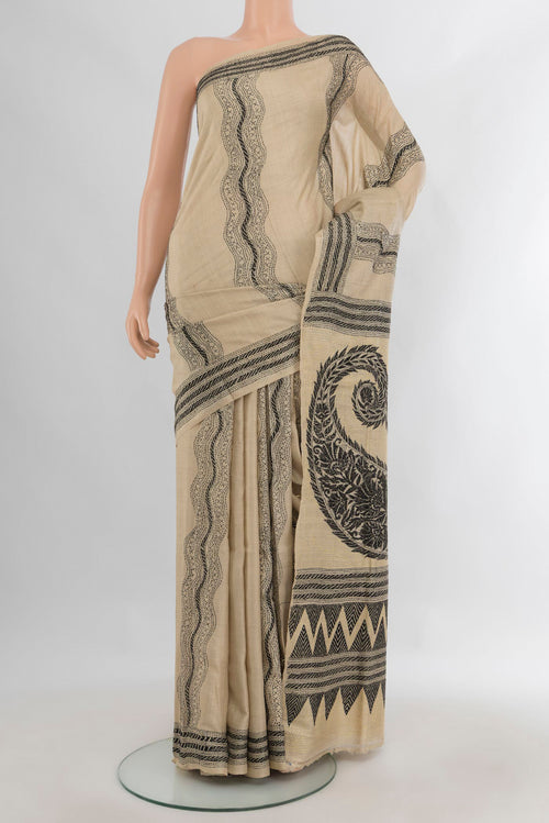 Beige Tussar Saree with Kantha Work on the body and Embroidery Border.  displayed on a mannequin