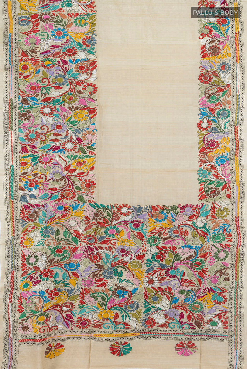 Flat view of Cream Tussar Saree with Kantha Work on the body and Embroidery Border. 