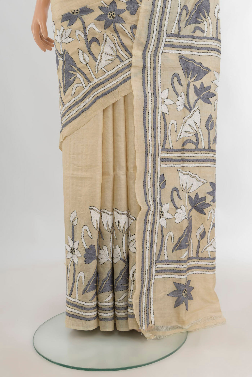 Pleats and pallu of Cream Tussar Saree with Plain Body and Embroidery Border. 