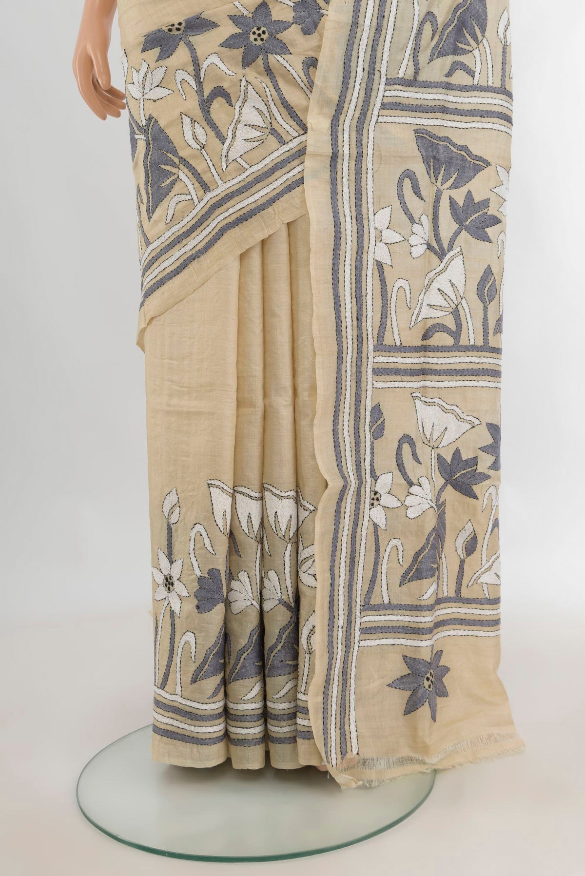 Pleats and pallu of Cream Tussar Saree with Plain Body and Embroidery Border. 