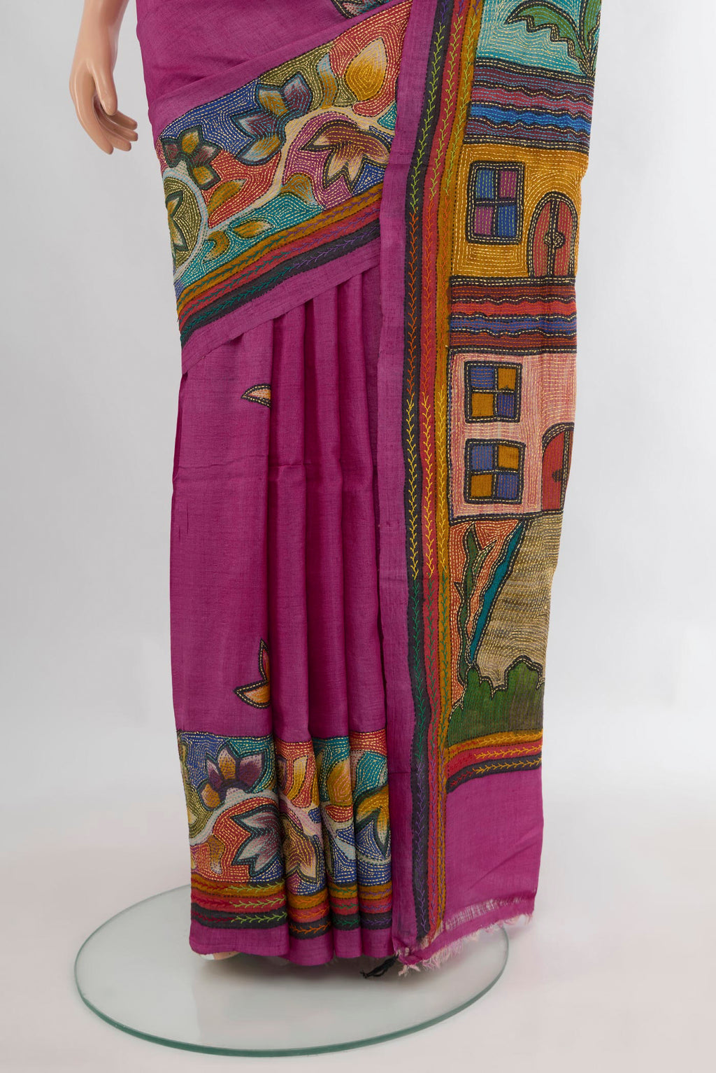 Pleats and pallu of Magenta Tussar Saree with Kantha Work on the body and Embroidery Border. 