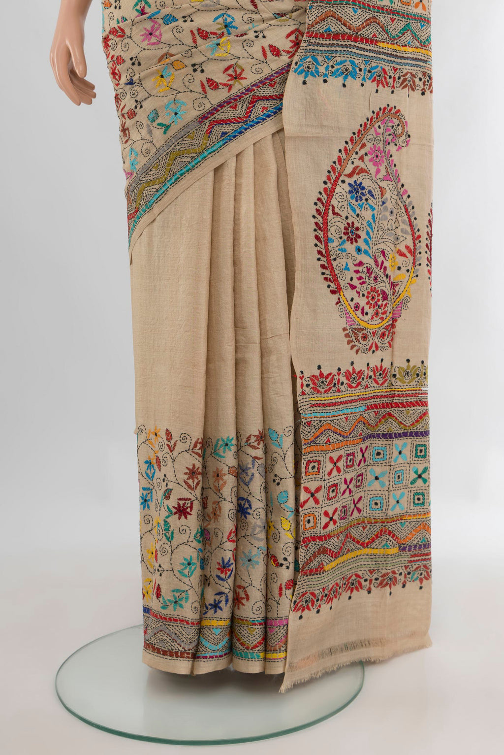 Pleats and pallu of Beige Tussar Saree with Embroidery on the body and Embroidery Border. 