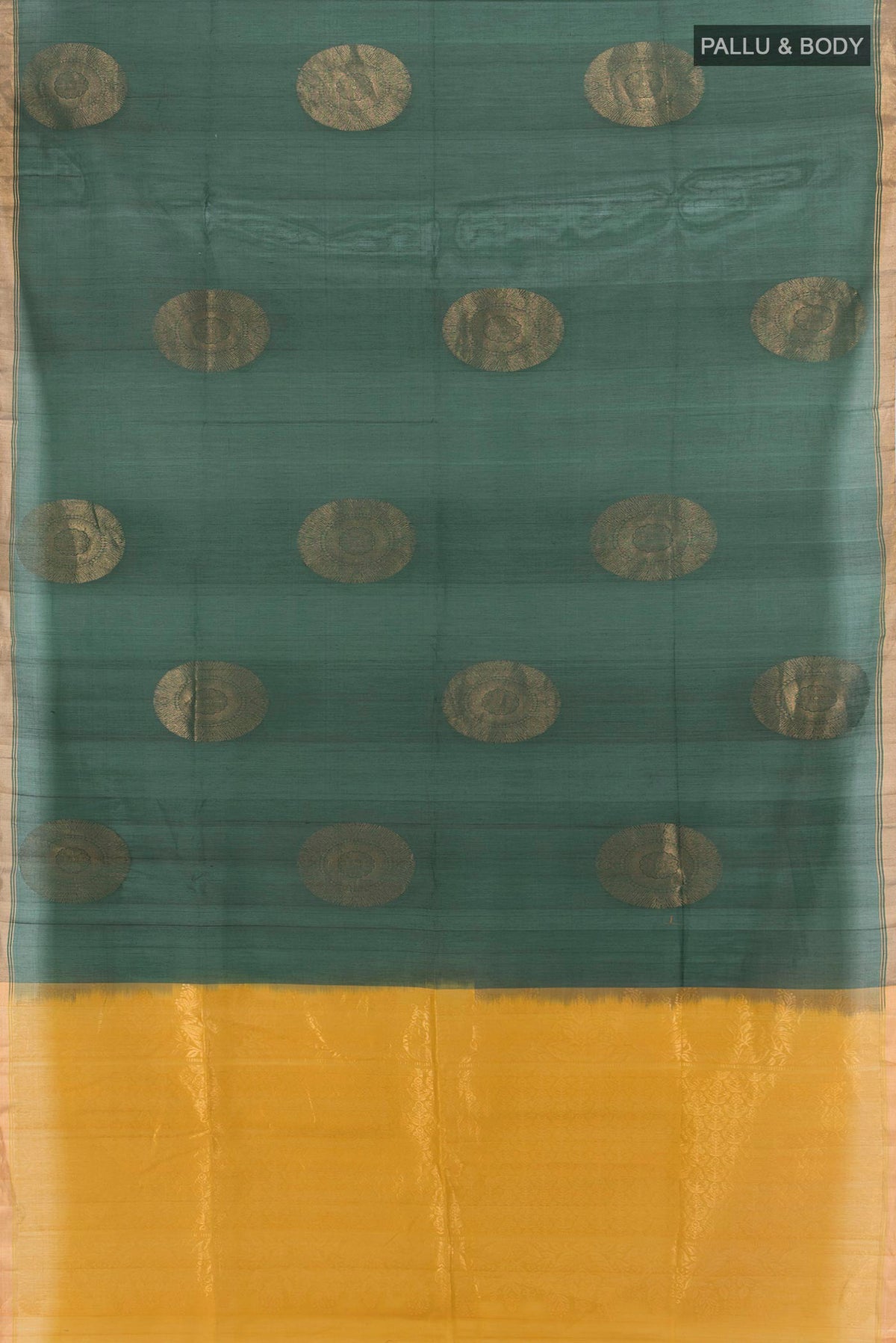 Flat view of Bottle Green Silk Cotton Saree with Zari Butta on the body and Zari Border. 