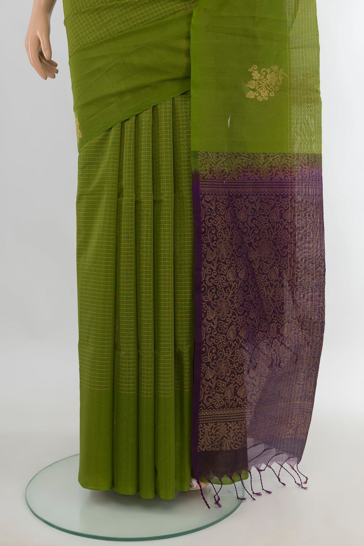 Pleats and pallu of Light Green Silk Cotton Saree with Checked design on the body and Without Border. 
