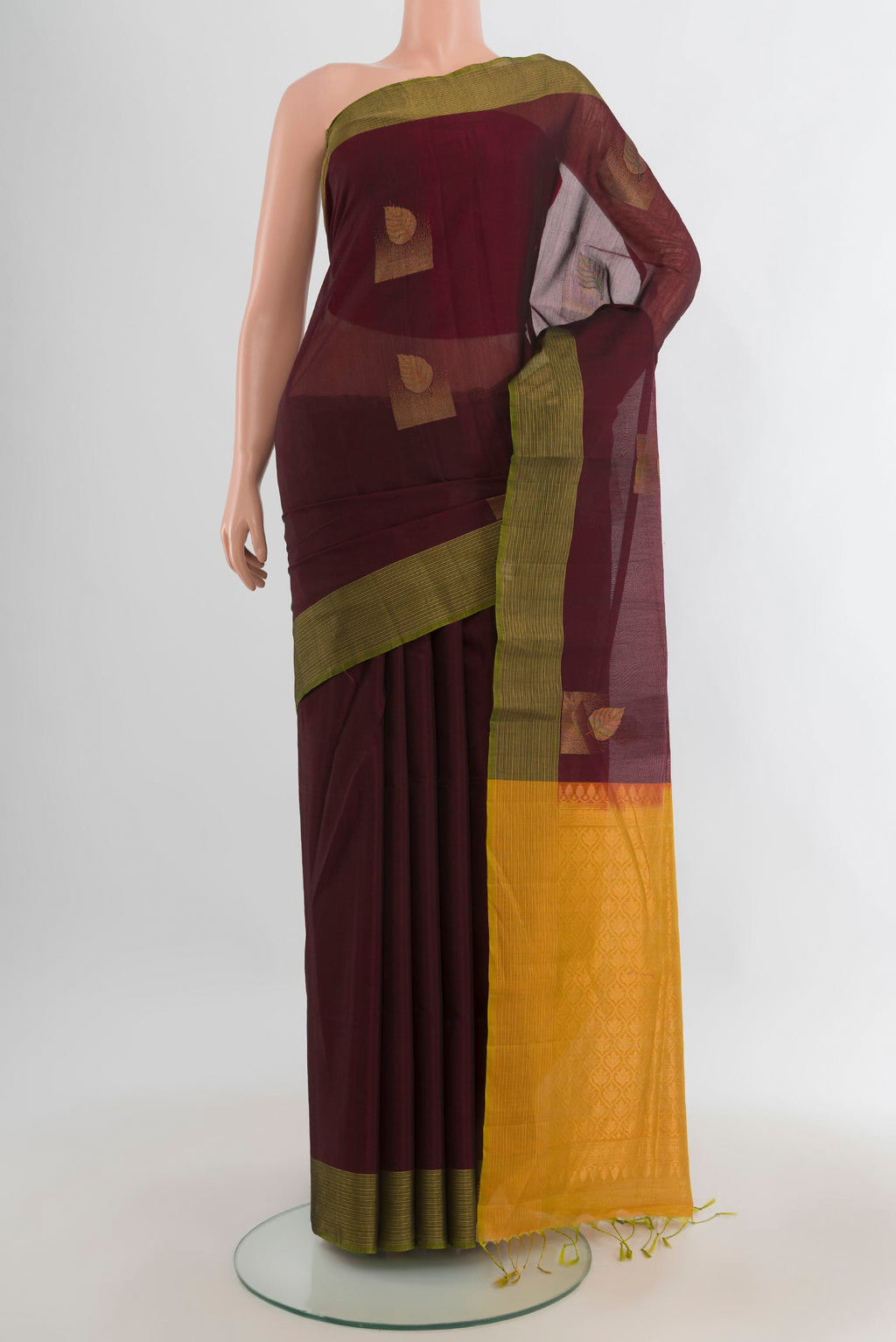 Coffee Brown Silk Cotton Saree with Zari Butta on the body and Zari Border.  displayed on a mannequin