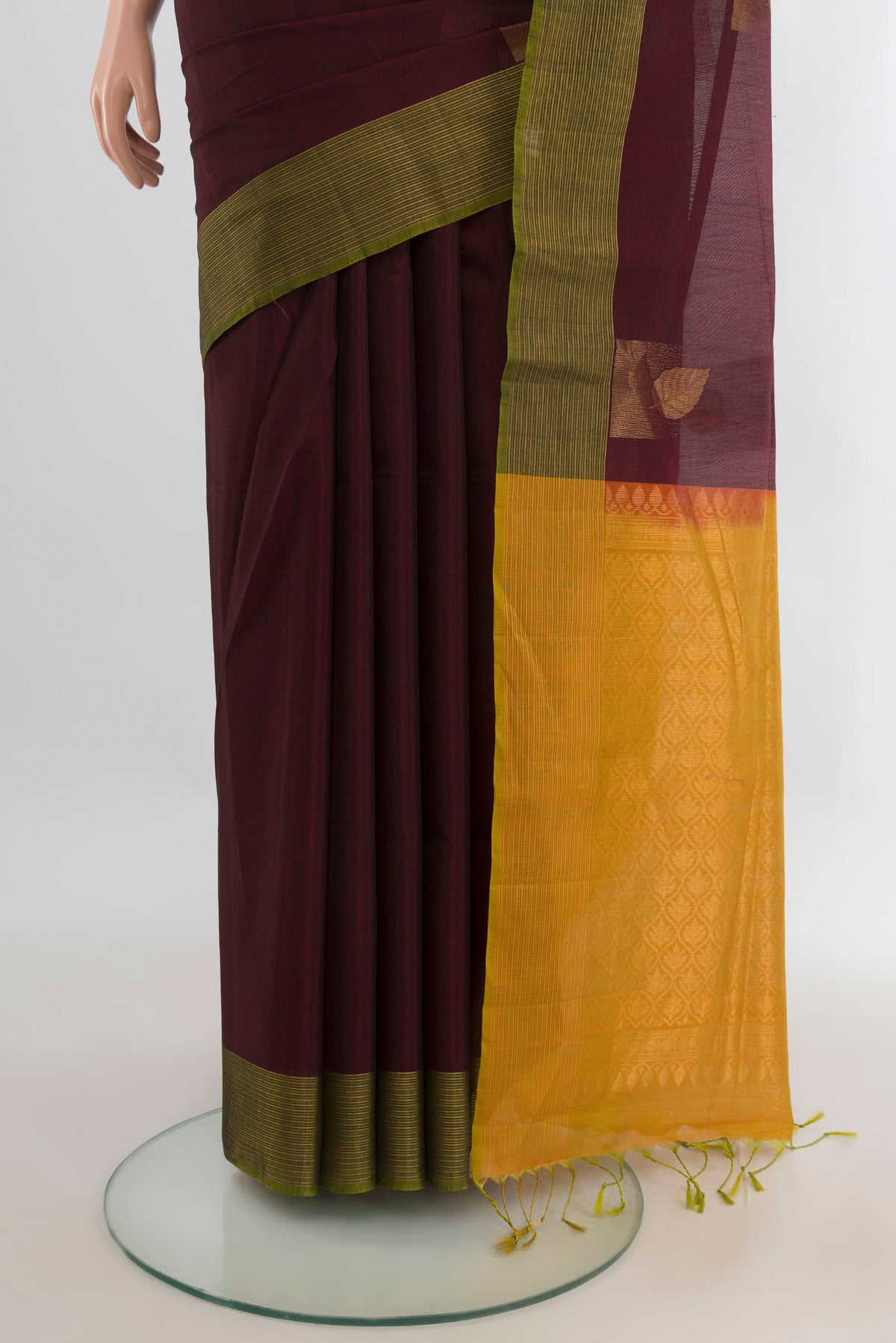 Pleats and pallu of Coffee Brown Silk Cotton Saree with Zari Butta on the body and Zari Border. 