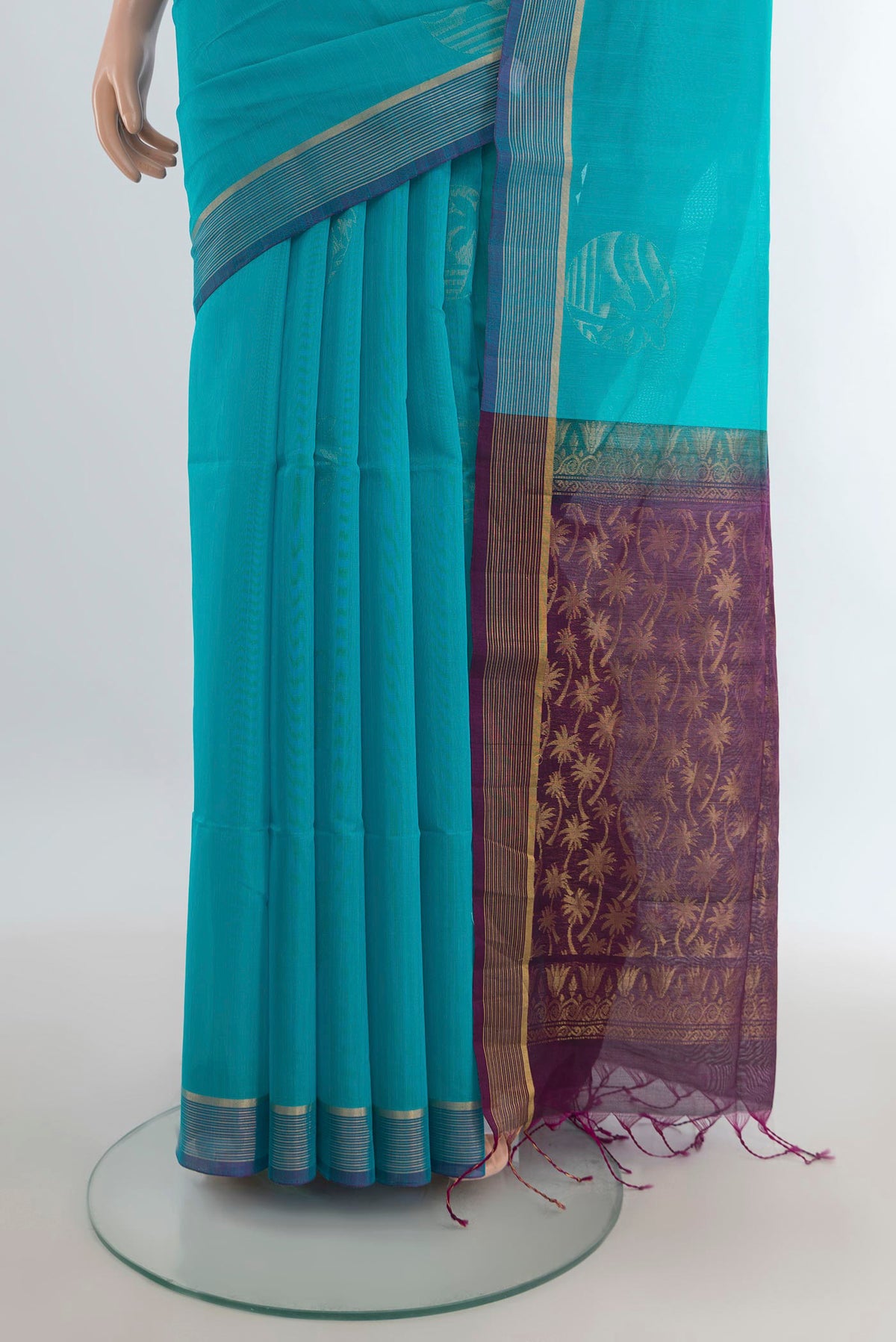 Pleats and pallu of Light Blue Silk Cotton Saree with Zari Butta on the body and Zari Border. 