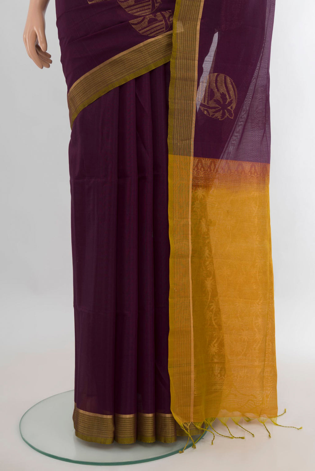 Pleats and pallu of Burgundy Silk Cotton Saree with Zari Butta on the body and Zari Border. 