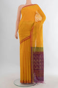 Mustard Kora Cotton Saree with Zari Butta on the body and Plain Border.  displayed on a mannequin