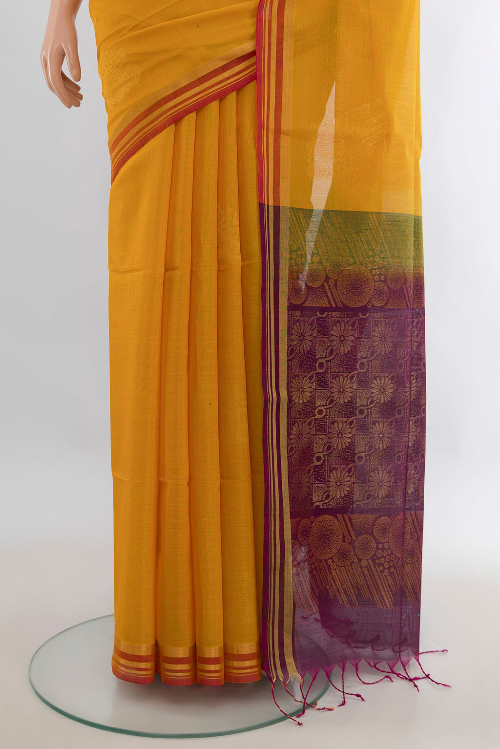 Pleats and pallu of Mustard Kora Cotton Saree with Zari Butta on the body and Plain Border. 