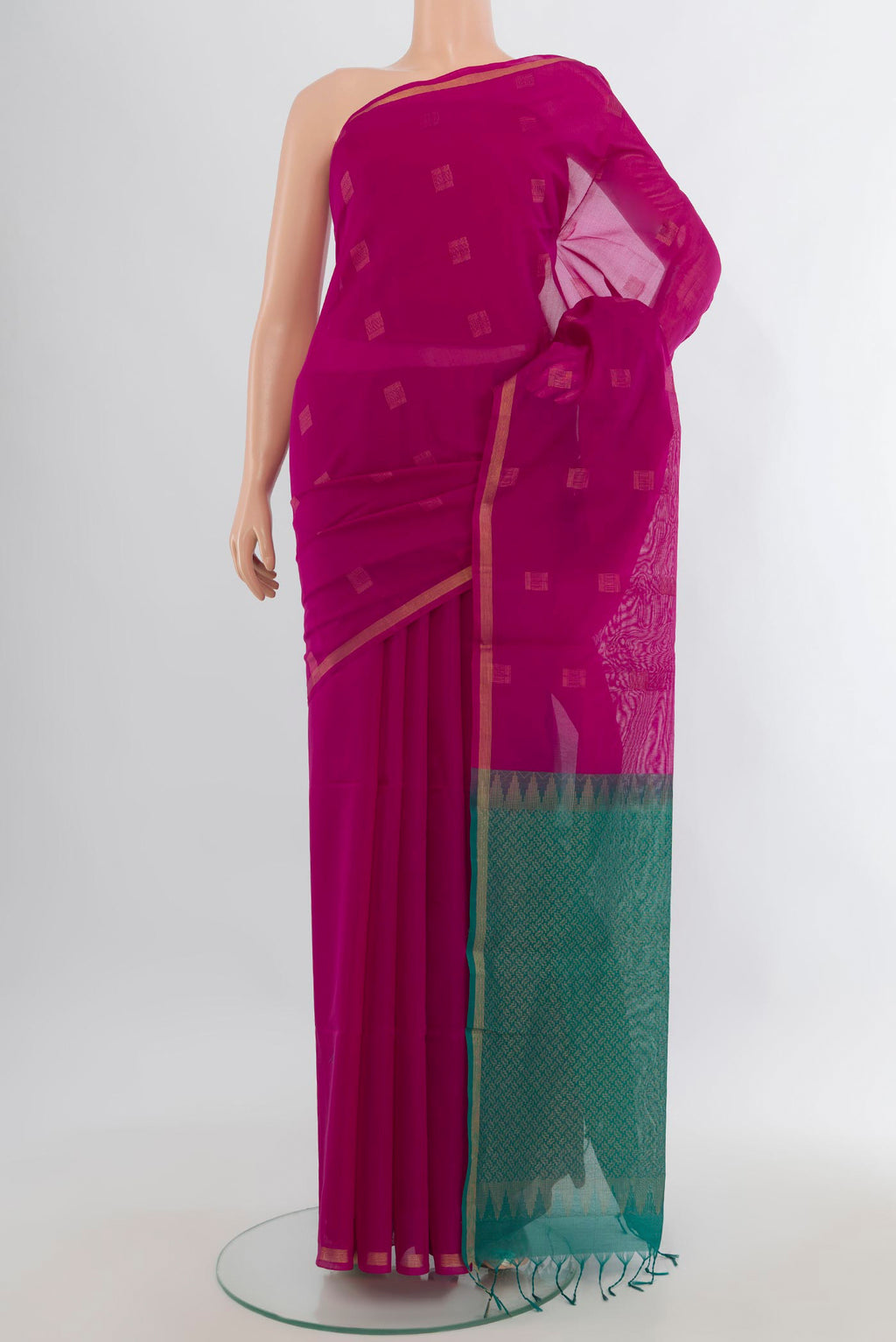 Pink Silk Cotton Saree with Zari Butta on the body and Zari Border.  displayed on a mannequin