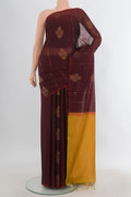 Brown Silk Cotton Saree with Zari Butta on the body and Zari Border.  displayed on a mannequin