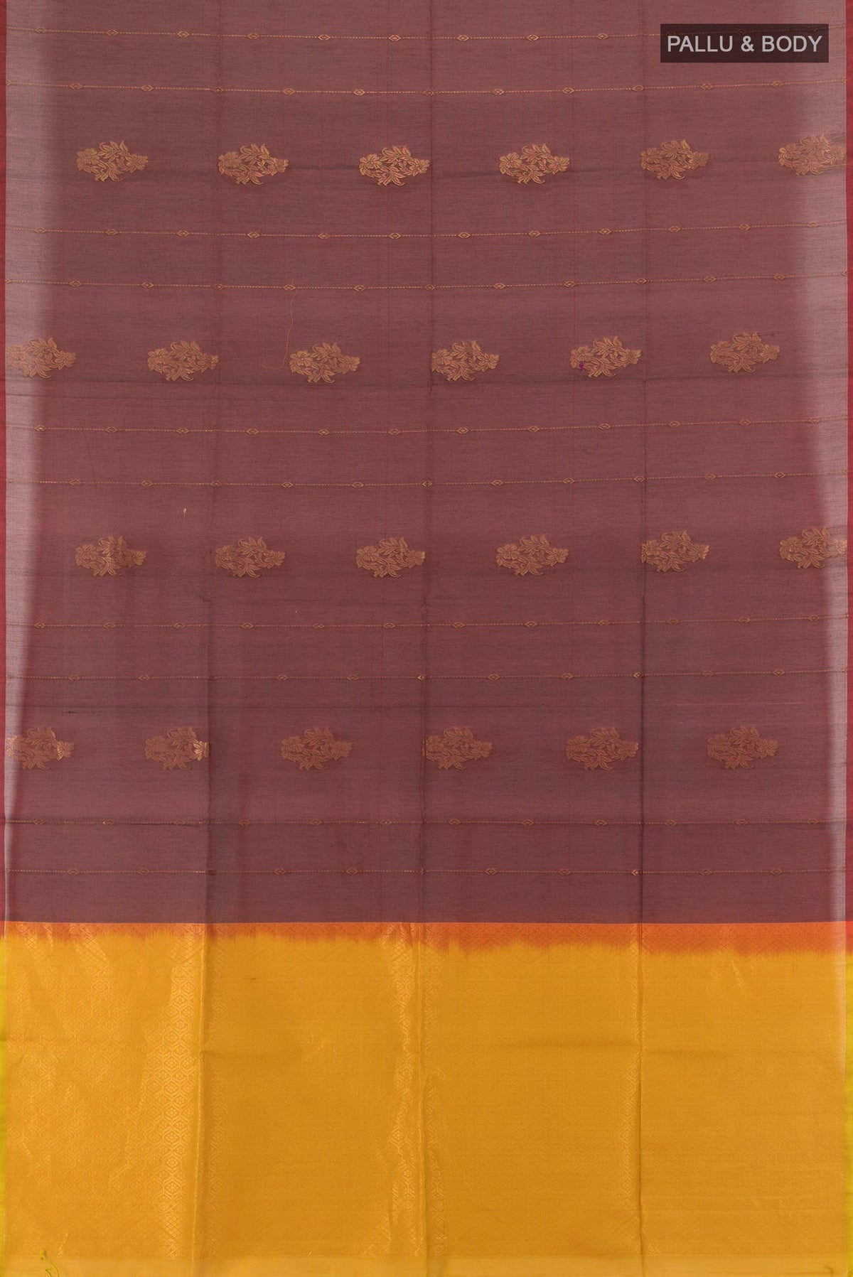 Flat view of Brown Silk Cotton Saree with Zari Butta on the body and Zari Border. 